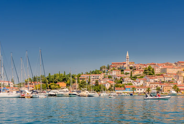 Croatian charter marina at sunrise with anchored boats