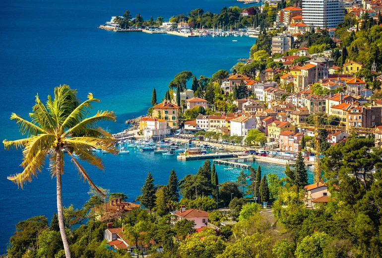 Croatian island village with anchored sailboats in the bay