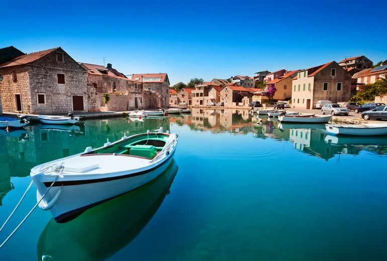 Catamaran at anchor in a clear Croatian bay