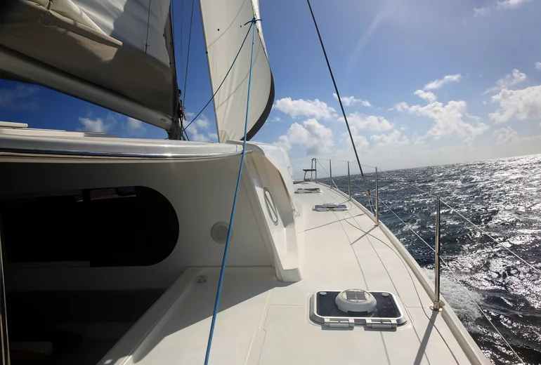 Croatian island bay with anchored catamarans