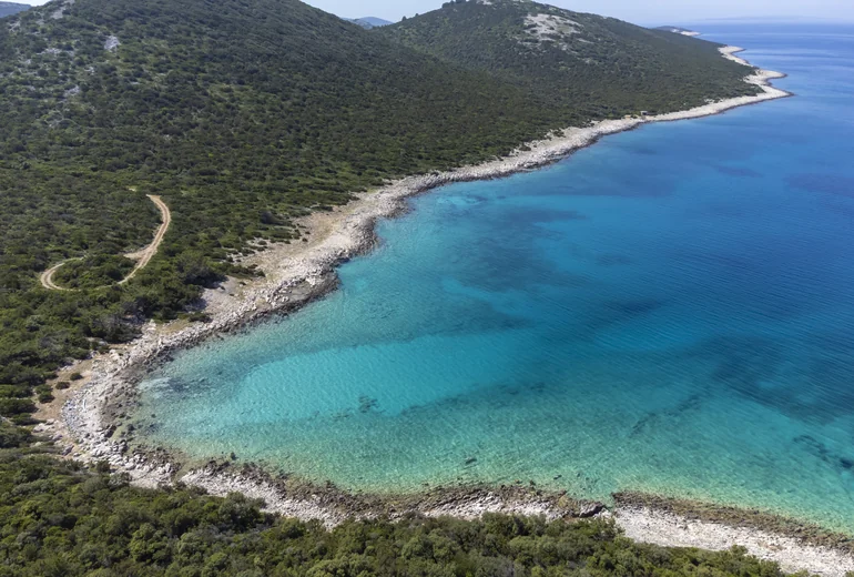 Adriatic coastline with islands and anchored boats