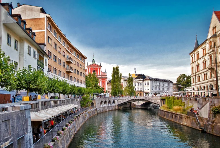View along a Croatian inlet with stone walls and traditional buildings