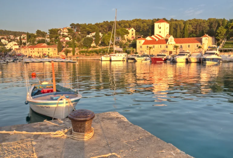 Aerial view of Brač island coastline with sailing boats