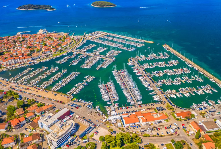 Aerial of Biograd na Moru town and marina packed with yachts and islands offshore