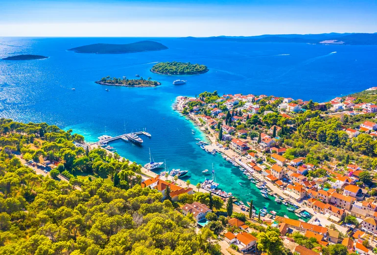 Aerial of Maslinica village on Šolta with offshore islets and a small marina