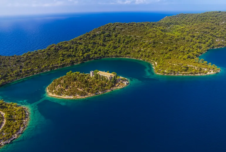 Aerial of the Saint Mary monastery islet in a Mljet National Park salt lake