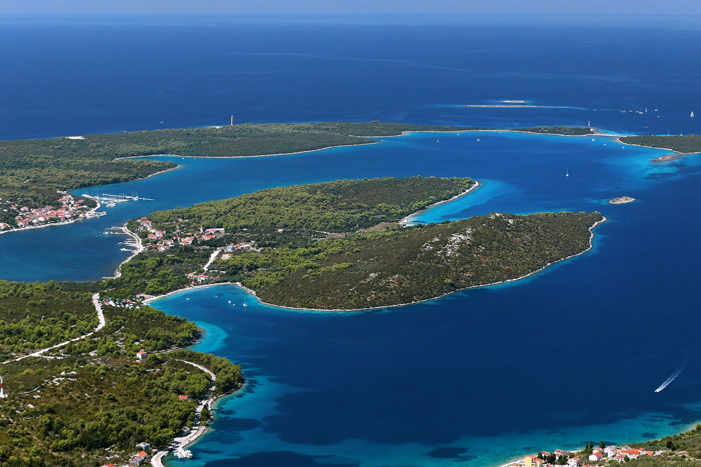 Aerial panorama of wooded coves and channels around Bozava on Dugi Otok